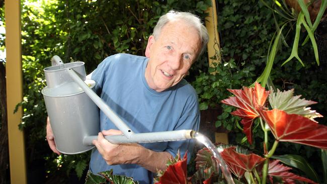 SA gardening authority Jon Lamb using watering can to water garden at his home in St Peters in 2009.