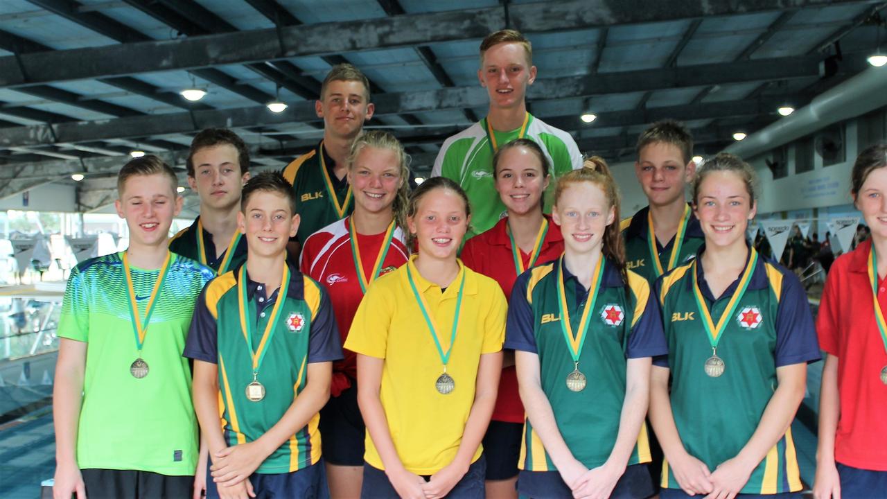 Assumption College age champions (back from left) Seamus Ryan, Nicholas Blakemore,(middle) Luke Hauff, Caitlin Skaines, Lily Osborne, Cooper Seng,(front) Matthew Blakemore, Jackson Pitstock, Ella Briggs, Faith Kelly, Mary Higgins, Samantha McMahon at WIRAC for the swimming carnival.