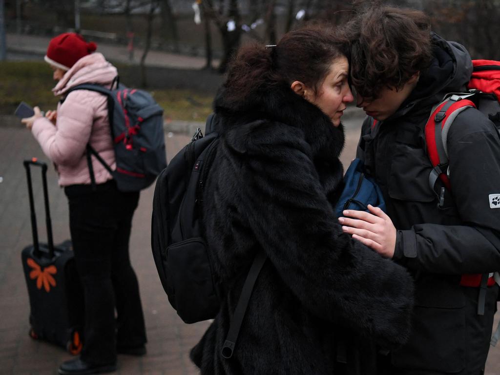 People outside a metro station in Kyiv as the attacks began. Picture: AFP