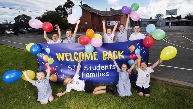 St John Vianney's Parkdale Primary School students celebrate returning to school on Monday Picture: Rob Leeson.