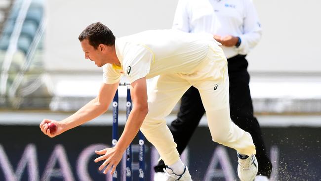 Australian bowler Josh Hazlewood dismisses England batsman Alastair Cook.