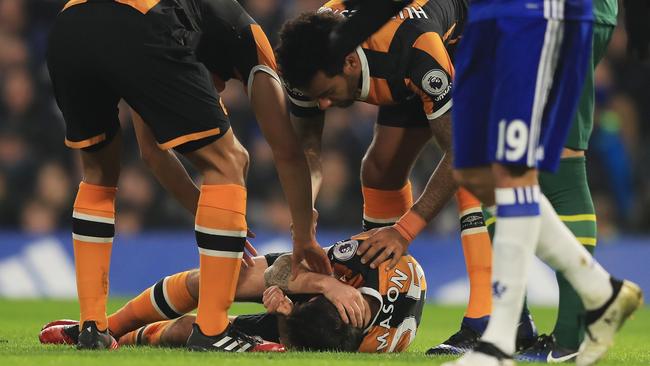 Ryan Mason of Hull City lies injured after the collision with Gary Cahill.