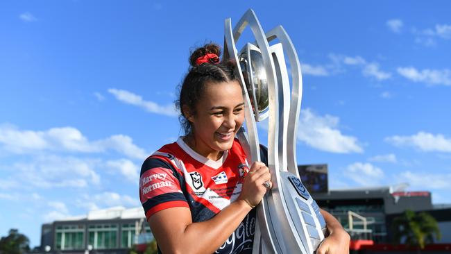 Roosters captain Corban Baxter poses with the Premiership trophy after her team's victory during the NRLW Grand Final match between the St George Illawarra Dragons and the Sydney Roosters at Moreton Daily Stadium, on April 10, 2022, in Brisbane, Australia. Picture: Albert Perez/Getty Images