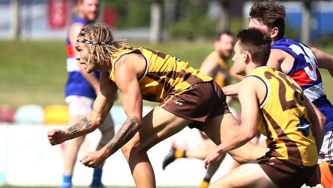 Hawks' Chris Novy clears the ball in the AFL Cairns match between the Manunda Hawks and the Centrals Trinity Beach Bulldogs, held at Cazalys Stadium, Westcourt. PICTURE: BRENDAN RADKE.