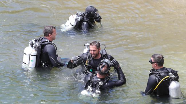 Police divers search for clues following the murder. Picture Glenn Hampson