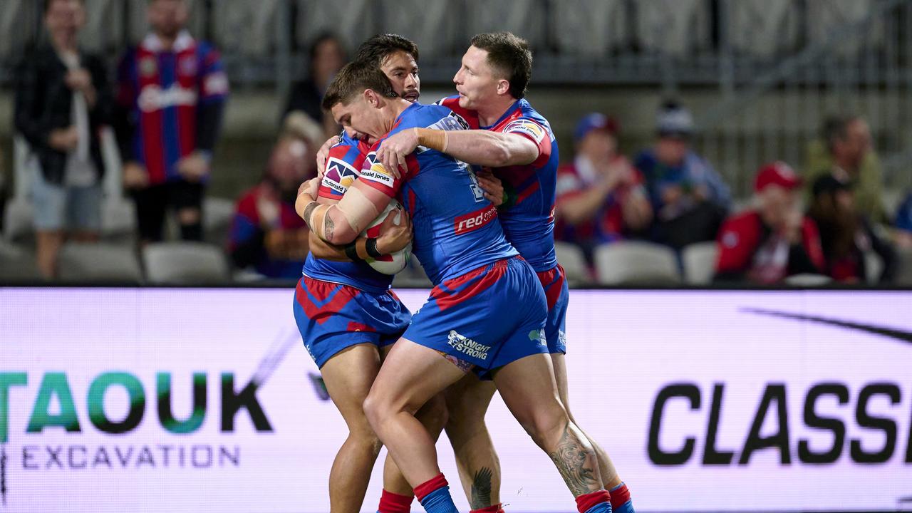 SYDNEY, AUSTRALIA - SEPTEMBER 02: Enari Tuala of the Knights celebrates scoring a try with team mates during the round 27 NRL match between St George Illawarra Dragons and Newcastle Knights at Netstrata Jubilee Stadium on September 02, 2023 in Sydney, Australia. (Photo by Brett Hemmings/Getty Images)