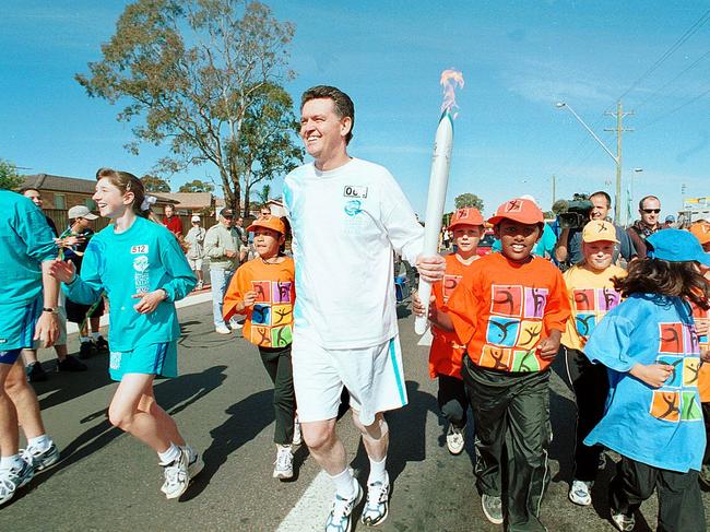 Michael Knight running with the Olympic torch on 04/09/00. Picture: Robert Pozo