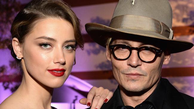 The marriage between Amber Heard and Johnny Depp imploded after a violent argument about poo, a friend claims. Picture: Michael Kovac/Getty Images for Art of Elysium