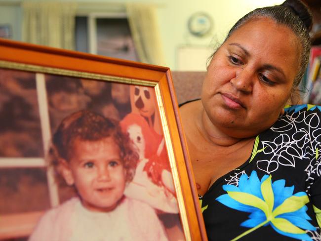 Michelle Jarrett, holds up a picture of her niece Evelyn Greenup in 2016. Picture: Frank Redward