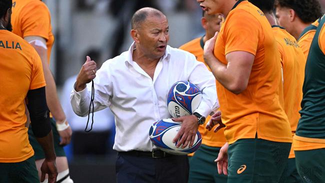 Australia's head coach Eddie Jones leads warm up prior to the  France 2023 Rugby World Cup Pool C match between Australia and Portugal at Stade Geoffroy-Guichard in Saint-Etienne, south-eastern France, on October 1, 2023. (Photo by SEBASTIEN BOZON / AFP)