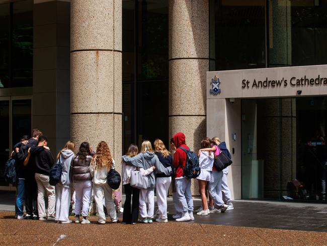 Students were among many to leave tributes at the school for Ms James. Picture: Justin Lloyd.