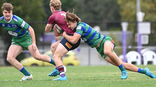 Joe Doljanin making a tackle on University flyhalf Isaac McAuliffe. University of Qld v GPS in Colts 1 Saturday June 22, 2024. Picture, John Gass