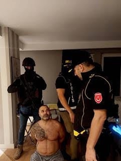 Hakan Ayik being arrested by Turkish police.