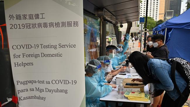 Migrant workers register for Covid-19 testing in the Central district of Hong Kong. Picture: AFP