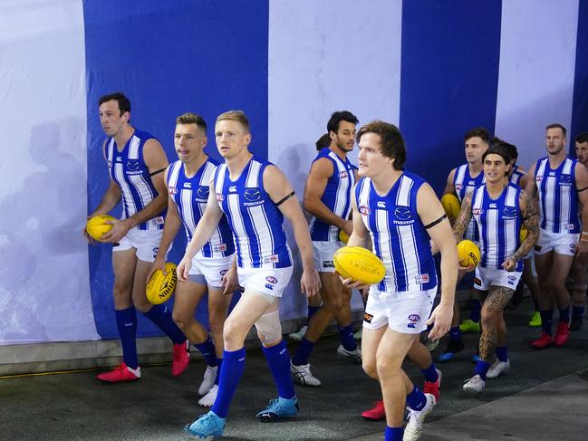 Todd Goldstein and Jack Ziebell of the Kangaroos lead their side out Picture: AAP Image/Scott Barbour