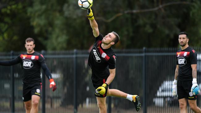 Goalkeepers Isaac Richards, Daniel Margush and Paul Izzo during an Adelaide United training session at their home ground in Elizabeth.