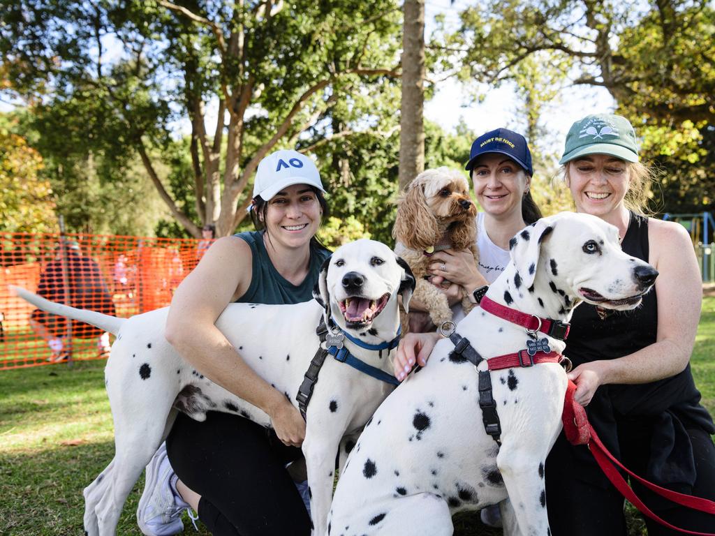 Sisters (from left) Siobhan, Ciara and Aisling McCann with their dogs Astro, Sadie and Finn on the Million Paws Walk in Queens Park, Sunday, May 25, 2025. Picture: Kevin Farmer