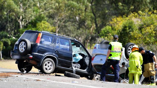 Emergency services attend a fatal crash involving three vehicles just north of the Yabulu Overpass. Picture: Alix Sweeney