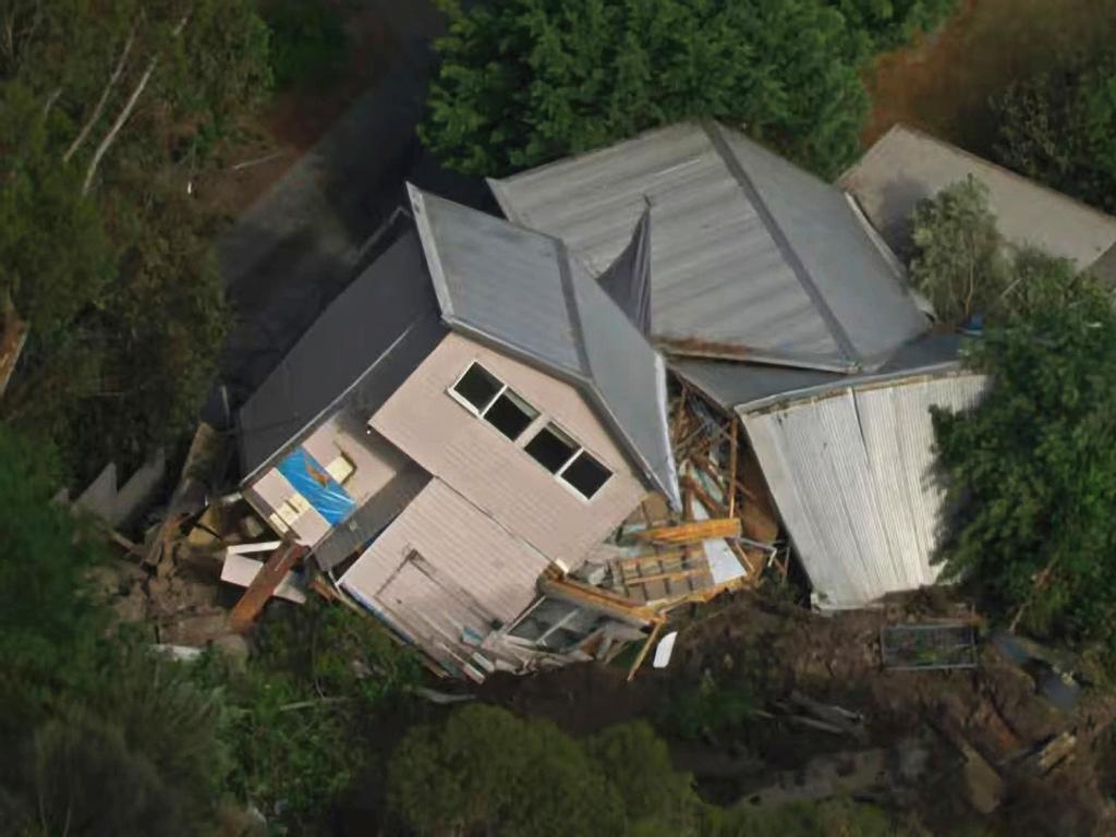 A council worker was injured a house toppled over in a landslide at McCrae. Picture: ABC News