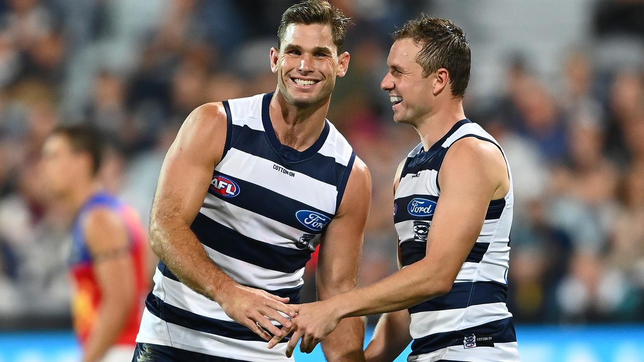 Cats Tom Hawkins and Mitch Duncan celebrate the win over Brisbane. Picture: Quinn Rooney/Getty Images