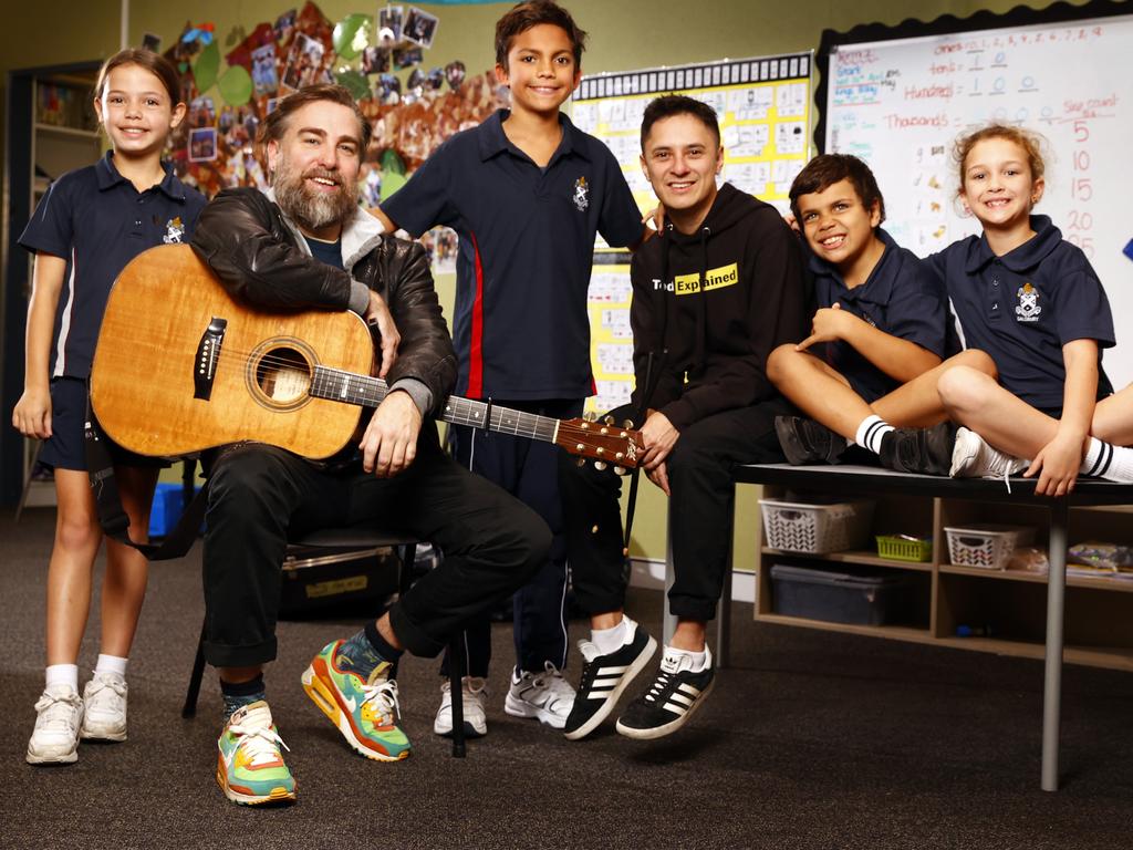 WEEKEND TELEGRAPH 1ST JUNE 2023 Pictured at St AndrewÃs Cathedral Gawura School in Sydney is Australian singer-songwriter Josh Pyke and Hip Hop artist Rhyan Clapham (DOBBY) with students Samara Lyons, Marlon Coulthard, Shane Jackson and Bokhara Rossiter. They are all involved in Busking For Change, a new annual fundraising activity developed by Indigenous Literacy Foundation Ambassador Josh Pyke to engage primary students in a joyful multi-literacy activity incorporating song, music, movement and language. Students learn a song in Indigenous Kriol as well as English and raise money before performing. The goal is to recruit 100 schools and raise $100,000 to support remote communities access and create books in native languages they speak at home. Picture: Richard Dobson