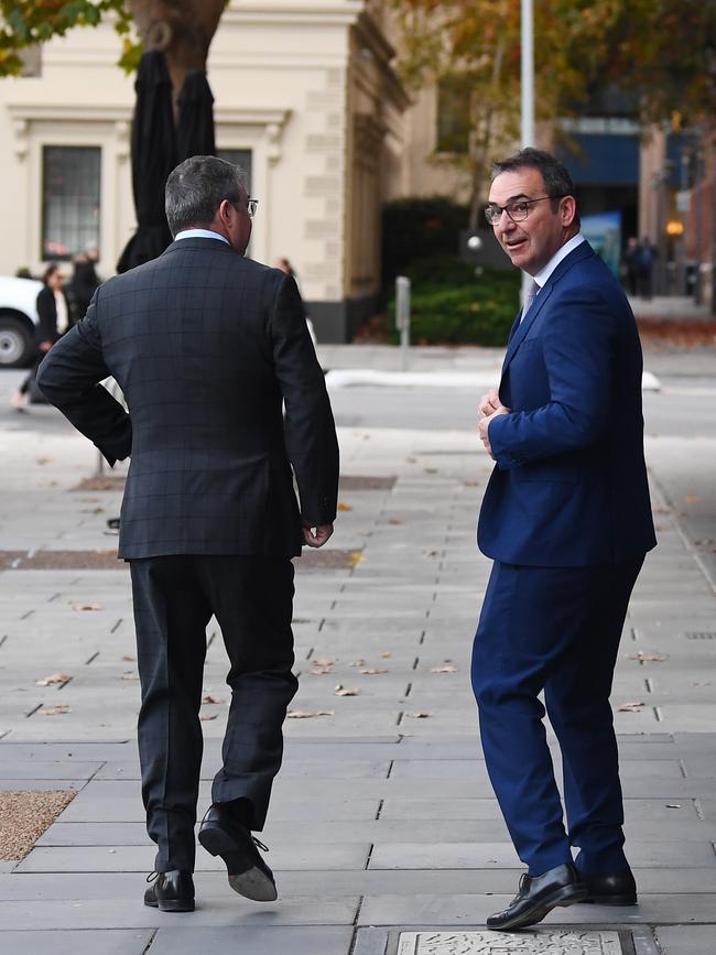 Premier Steven Marshall heads for a coffee with one of his advisers before the Transition Committee meeting at the State Administration Centre in Adelaide on Tuesday. Picture: Mark Brake