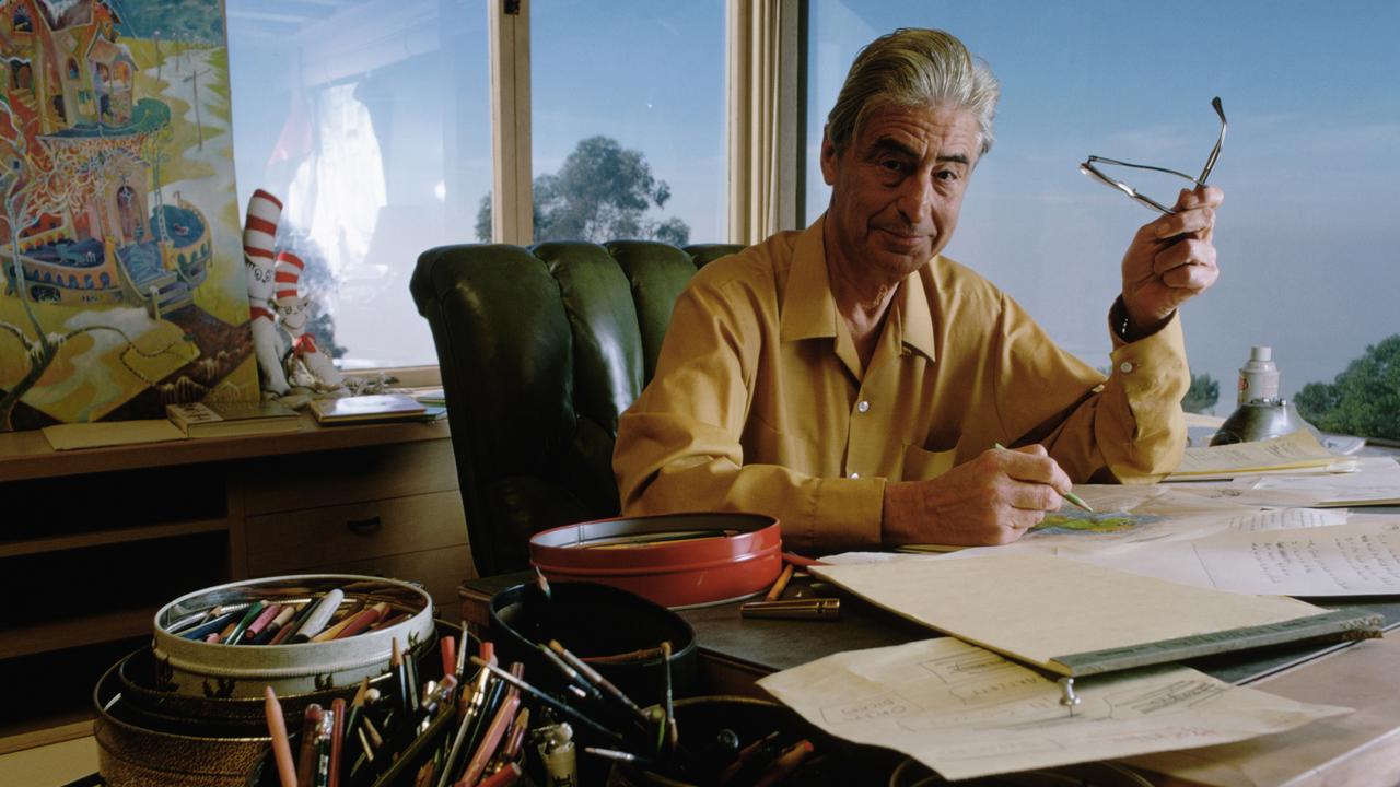 Dr. Seuss Drawing at His Desk