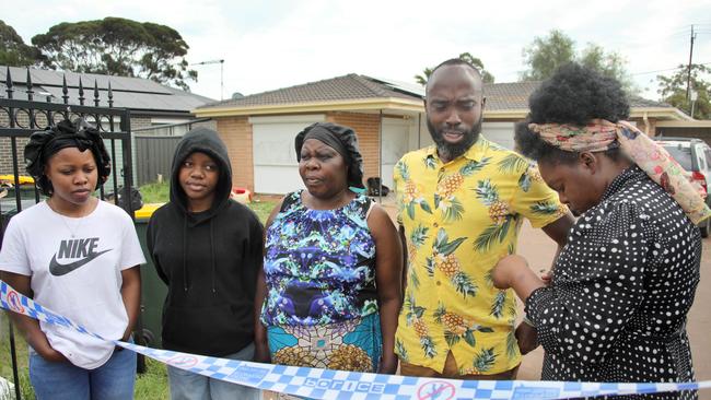 Eugenia Nzeyrimana (right), the sister of the stabbing victim Emmanuel Musengimana, at the scene with husband Jackson Bamvuga, and other family members. Picture: Dean Martin