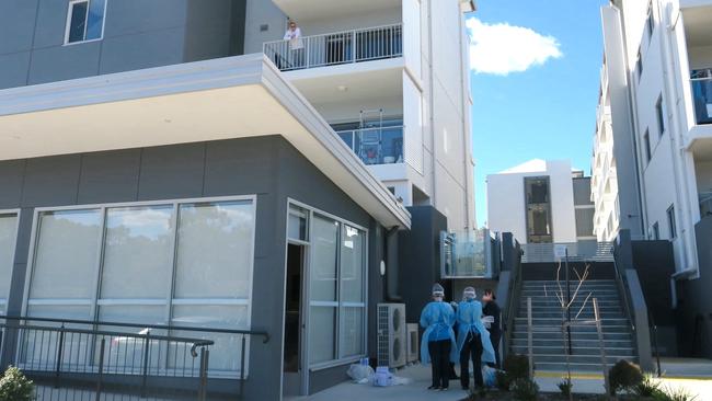 NSW Health workers conducting Covid tests at a unit block at Sturt Rd, Cardiff. Picture: Emily Burley.