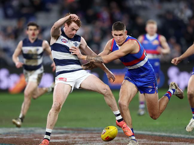 Rory Lobb shoves Gary Rohan out of the path of the ball. Picture: Mark Stewart