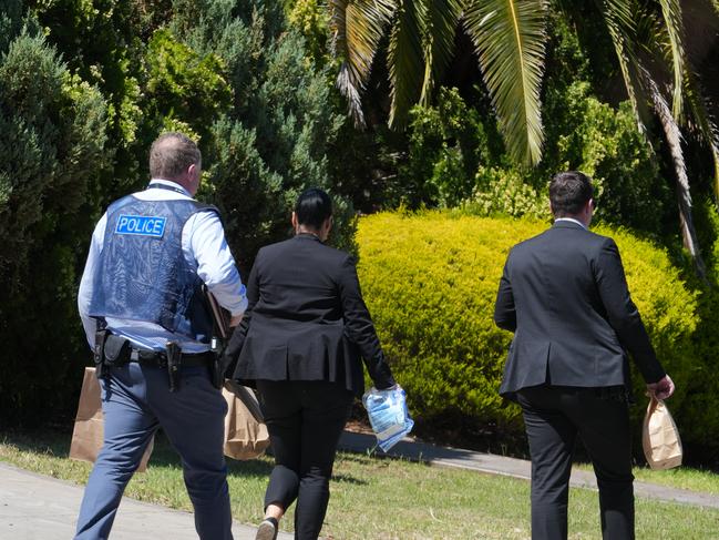 Police are investigating an incident at Gulfview Heights where two people were stabbed. Police collecting evidence at the property, including removing a machete from the rear of the house. 9 October 2024. Picture Dean Martin