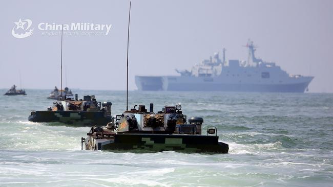 Amphibious armoured vehicles attached to a brigade of the PLA navy Marine Corps make their way to the beachhead during a maritime amphibious assault training in the west of south China's Guangdong Province. Picture: PLA