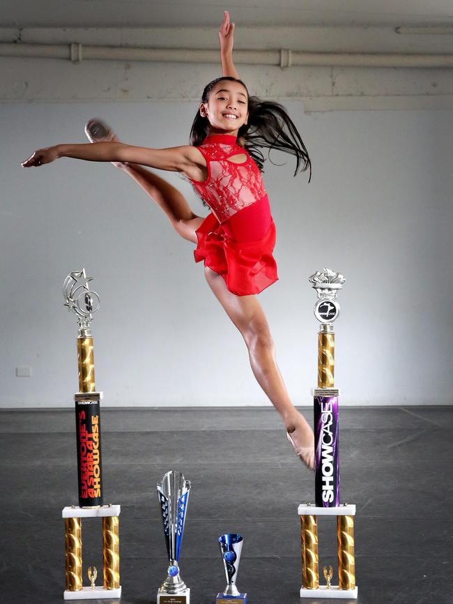 Isabella with some of her trophies.