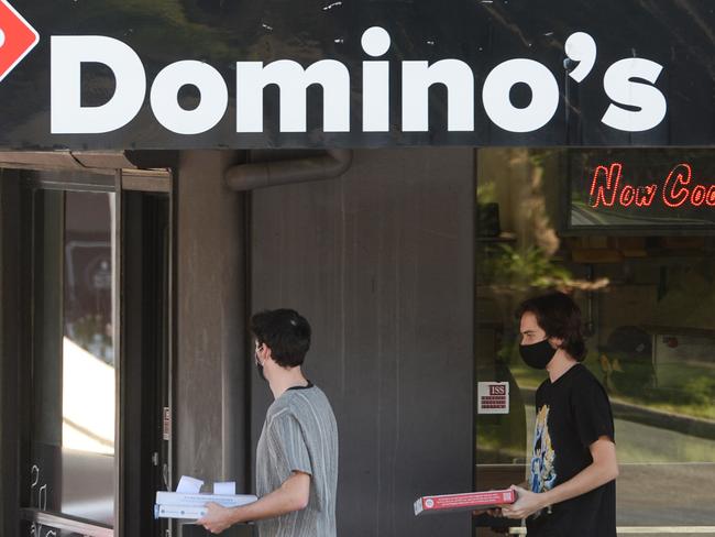 ADELAIDE, AUSTRALIA - NewsWire Photos AUGUST 30, 2021: Customers leave the Domino's Pizza store in Portrush Rd, Glenunga. Picture: NCA NewsWire / Brenton Edwards