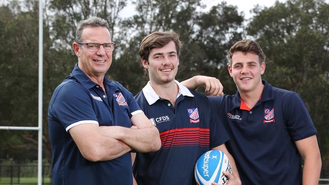 Legendary Easts figure Hamish McCathie with sons Jack and Max. Picture: Richard Dobson