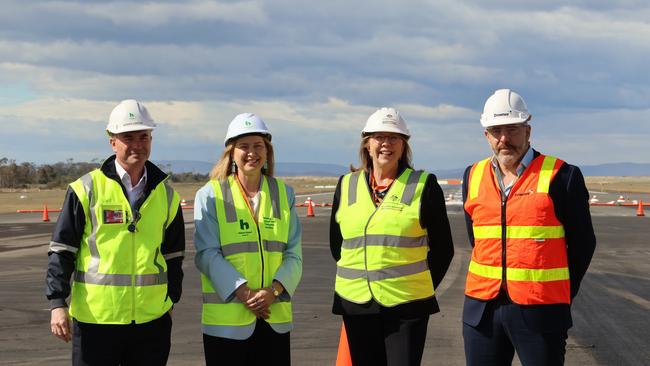 Norris Carter CEO Hobart Airport, Minister Julie Collins, Minister Catherine King, Simon Abrahams Downer Group on the runway at Hobart Airport. Picture: supplied