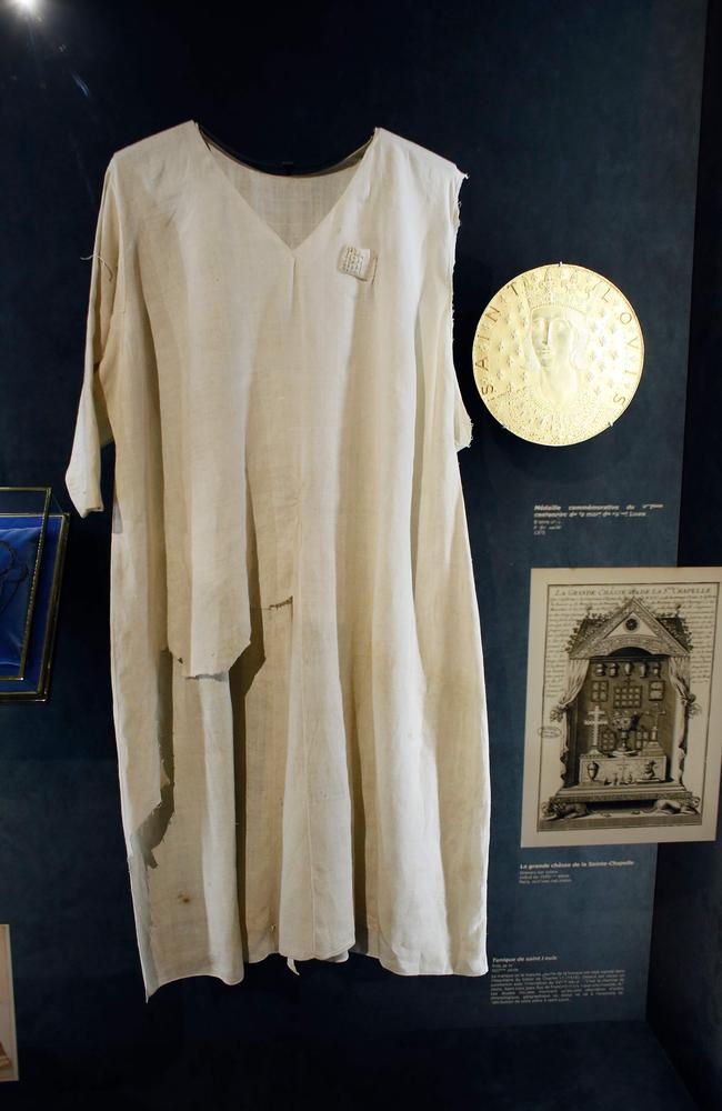 The tunic allegedly worn by the 13th-century French crusader king, Louis IX, who was made a saint, is displayed inside the Notre-Dame de Paris Cathedral in Paris which contained some of the most sacred relics of the Christian faith, including this tunic. Picture: Patrick Kovarik 