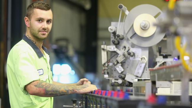 Joel Greaves working at the Carole Park-based CenturyYuasa factory. Picutre: Jono Searle.