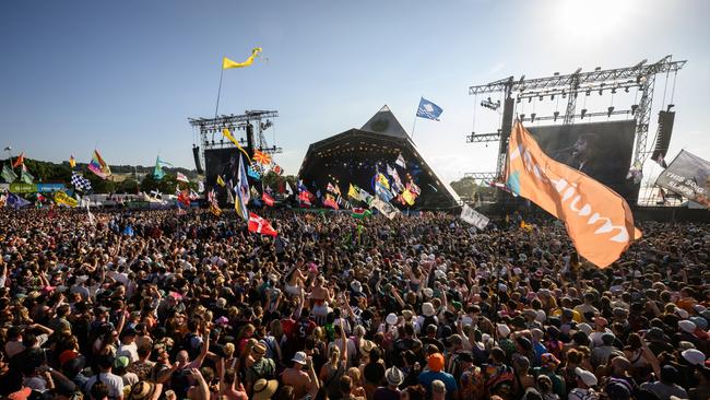 Revellers listen as the Foo Fighters perform on Glastonbury’s Pyramid Stage. Picture:: Leon Neal/Getty Images