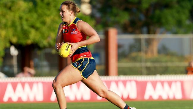 Danielle Ponter on her way to kicking a goal of the year contender. Picture: James Elsby/AFL Photos via Getty Images