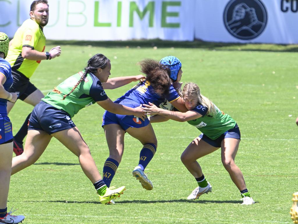 Jessica Nicholas (left) tries to tackle Fontayne Tufuga. Picture: Martin Ollman