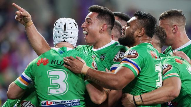 Raiders players celebrate John Bateman’s matchwinning try against the Storm. Picture: AAP