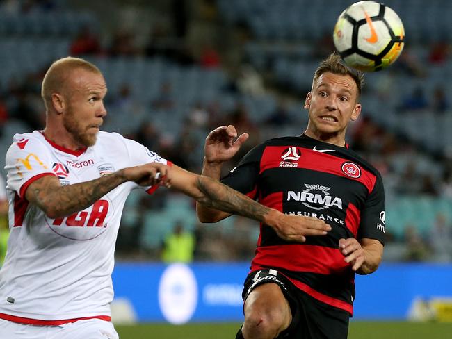 Brendon Santalab (right) tussles with Adelaide United's Taylor Regan. Picture: Toby Zerna