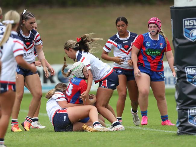 Emily McArthur is tackled. Picture: Sue Graham