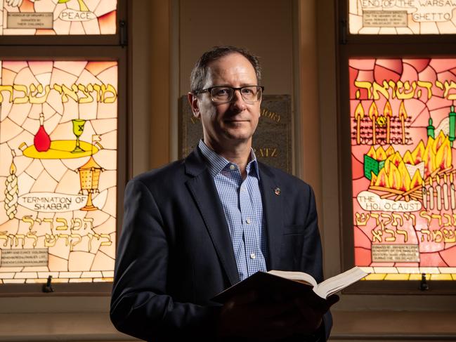 24-01-2022 Jason Steinberg who is on the organising committee to build the Queensland Holocaust Museum in Brisbane. They are putting a call out to the community to come forward with personal stories, artefacts to display at the museum. Pictured in front of stain glass windows remembering the holocaust victims at the Brisbane Synagogue. PICTURE: Brad Fleet