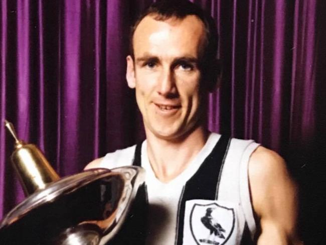 Brunswick great Barry Nolan with the VFA premiership trophy.