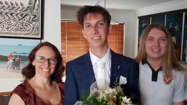 Cameron Duce preparing for his formal after graduating from Merrimac State High School. To his left, his mother Sonia, and younger sister Tayla to his right.