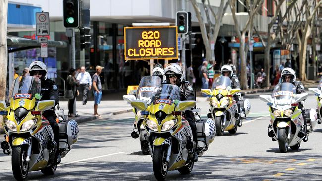 Colour from the Remembrance Day cermony at Anzac Square. There was a heavy police presence ahead of the G20. Pic by Luke Marsden.