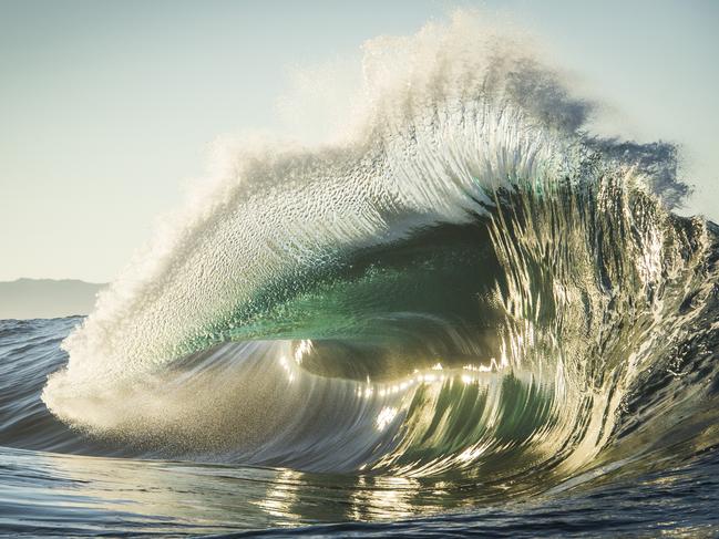 Golden Flare ... “Golden Flare” was taken last autumn at a remote reef off the coast of Western Australia. After an overnight journey we reached our destination, camping on a secluded beach we set out on the jet-ski at first light. This particular wave is intimidating and incredible. Ocean swells generated by powerful Southern Ocean storms&nbsp;rise up and break on a shallow reef shelf situated a mile out to sea. Shallow water and hydrodynamics create backwash forcing water back towards the oncoming swell. When timed correctly the collision is amazing. I managed to frame and capture this image as the wave exploded into the morning light whilst driving and manoeuvring the jet-ski. Picture: Gordon Becker, Australia, 2nd Place, National Awards, 2017 Sony World Photography Awards