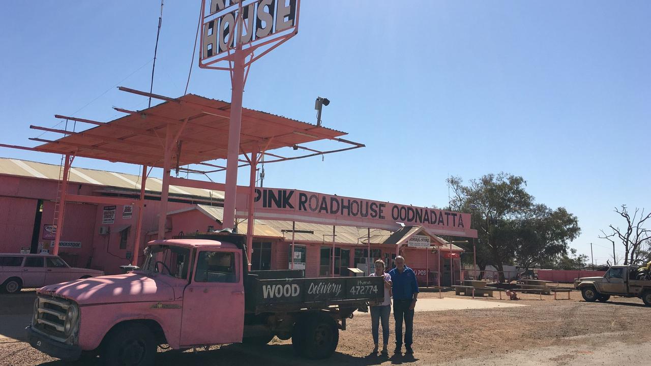 Peter Moore and his wife Jen outside The Pink Roadhouse in Oodnadatta.